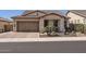 Attractive home with tile roof, desert landscaping, and a brick driveway at 26978 N 74Th Ln, Peoria, AZ 85383