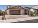 Lovely home featuring a tile roof, brick driveway, and desert-style landscaping at 26978 N 74Th Ln, Peoria, AZ 85383