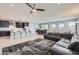 Spacious living area with an open-concept design, connecting the kitchen, dining, and lounge spaces at 26978 N 74Th Ln, Peoria, AZ 85383