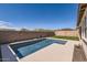 Relaxing pool area with pristine blue water, surrounded by stone patio and landscape at 26978 N 74Th Ln, Peoria, AZ 85383