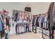 Organized walk-in closet with ample hanging space and storage solutions at 26978 N 74Th Ln, Peoria, AZ 85383