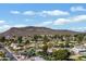 Beautiful aerial view of the community with golf course, mountain views, and blue skies at 339 W Southern Hills Rd, Phoenix, AZ 85023