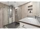 Modern bathroom featuring a glass shower with rain shower head and a sink with quartz countertop at 339 W Southern Hills Rd, Phoenix, AZ 85023