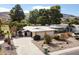 Expansive single-story home boasts desert landscaping, a long driveway, and serene views at 339 W Southern Hills Rd, Phoenix, AZ 85023