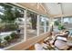 Cozy living room with large windows offering views of the landscaped backyard and neighborhood at 339 W Southern Hills Rd, Phoenix, AZ 85023