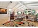 Spacious living room with vaulted ceilings, large windows, comfortable seating, and backyard views at 339 W Southern Hills Rd, Phoenix, AZ 85023