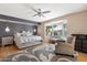Bright main bedroom featuring a ceiling fan, a comfortable chair and bay window with natural light at 339 W Southern Hills Rd, Phoenix, AZ 85023
