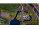 Aerial view of the community park with lush trees, water features, walking paths, and playground offering recreational amenities at 3690 E Blue Spruce Ln, Gilbert, AZ 85298