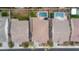 A birds-eye view of a well-maintained property with a private pool, lush landscaping, and a pristine roof at 3690 E Blue Spruce Ln, Gilbert, AZ 85298