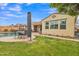 Spacious backyard with lush green lawn, mature landscaping, and an inviting patio perfect for outdoor living at 3690 E Blue Spruce Ln, Gilbert, AZ 85298