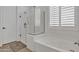 Bright bathroom featuring a soaking tub and walk-in shower with neutral tones at 3690 E Blue Spruce Ln, Gilbert, AZ 85298