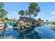 Welcoming entrance to The Bridges at Gilbert with a tranquil waterfall and lush landscaping creating a serene setting at 3690 E Blue Spruce Ln, Gilbert, AZ 85298