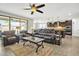 Open-concept living room is bright with natural light and combines with the kitchen for seamless entertaining at 3690 E Blue Spruce Ln, Gilbert, AZ 85298