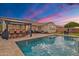 Backyard pool and patio area with outdoor seating, ideal for relaxing and entertaining in the Arizona heat at 3690 E Blue Spruce Ln, Gilbert, AZ 85298