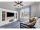 Bright bedroom with a daybed, built in shelving and drawers, and a large window at 4144 E Blossom Ct, Gilbert, AZ 85297