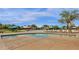 The community pool features many lounge chairs with shaded umbrellas at 4144 E Blossom Ct, Gilbert, AZ 85297