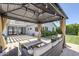 Inviting covered patio with stylish furniture, perfect for outdoor lounging and entertaining, with meticulous landscaping at 4402 E Montecito Ave, Phoenix, AZ 85018