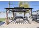 This backyard features a covered patio with comfortable seating, creating the perfect setting for outdoor gatherings at 4402 E Montecito Ave, Phoenix, AZ 85018