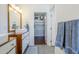 Bathroom featuring double sinks, wood cabinets, and open access to walk-in closet at 4402 E Montecito Ave, Phoenix, AZ 85018