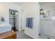 Bright bathroom with a glass shower, double sinks, and access to a walk-in closet at 4402 E Montecito Ave, Phoenix, AZ 85018