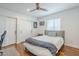 This bedroom is a calm oasis with a queen bed, wood floors, and ample storage in the built-in closet at 4402 E Montecito Ave, Phoenix, AZ 85018