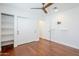 This bedroom offers ample storage with built-in shelving and closet, all with modern fixtures and hardware at 4402 E Montecito Ave, Phoenix, AZ 85018