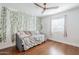 Cozy bedroom with hardwood floors and decorative leafy vines at 4402 E Montecito Ave, Phoenix, AZ 85018