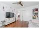 Bedroom featuring hardwood floors, ceiling fan, and dresser at 4402 E Montecito Ave, Phoenix, AZ 85018