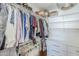 Walk-in closet features built-in shelving, drawers and clothing racks at 4402 E Montecito Ave, Phoenix, AZ 85018