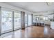 Open-concept space with hardwood floors, leading to the kitchen and a patio with outdoor seating at 4402 E Montecito Ave, Phoenix, AZ 85018