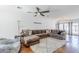Cozy living room with hardwood floors, a sectional sofa, and a comfortable seating area, perfect for lounging at 4402 E Montecito Ave, Phoenix, AZ 85018