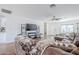 Open-concept living room featuring hardwood floors, white walls, and stylish furnishings creating an inviting atmosphere at 4402 E Montecito Ave, Phoenix, AZ 85018