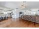 Open floor plan with hardwood floors, kitchen, dining area, and living room, creating a cohesive space at 4402 E Montecito Ave, Phoenix, AZ 85018