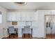 Bright office nook with built-in desk, white cabinets, and stainless steel refrigerator at 4402 E Montecito Ave, Phoenix, AZ 85018