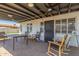 Charming back patio featuring a covered seating area, ceiling fans, and a brick paved floor at 4521 W Clarendon Ave, Phoenix, AZ 85031