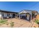 Backyard featuring a covered patio, brick accents, and an outdoor kitchen at 4521 W Clarendon Ave, Phoenix, AZ 85031