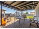 Inviting backyard patio with a covered seating area, ceiling fan, and brick pavers at 4521 W Clarendon Ave, Phoenix, AZ 85031