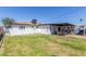 Backyard with grass, patio, and a well-maintained exterior at 4521 W Clarendon Ave, Phoenix, AZ 85031