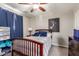 Comfortable bedroom featuring a wooden bed frame, soft bedding, and stylish decor elements for a relaxing atmosphere at 4521 W Clarendon Ave, Phoenix, AZ 85031