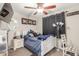 Comfortable bedroom featuring a ceiling fan, white furniture and black-out curtains at 4521 W Clarendon Ave, Phoenix, AZ 85031