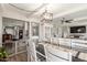 Open-concept dining room with modern decor and a view into the living spaces at 4521 W Clarendon Ave, Phoenix, AZ 85031