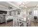 Open-concept dining room with a ceiling fan and abundant natural light from many windows at 4521 W Clarendon Ave, Phoenix, AZ 85031