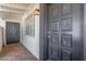 Inviting entryway featuring a beautifully detailed front door and brick flooring at 4521 W Clarendon Ave, Phoenix, AZ 85031