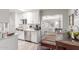 Bright kitchen with white cabinets, stainless steel appliances, and an open layout connecting to the dining area at 4521 W Clarendon Ave, Phoenix, AZ 85031