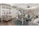 Inviting living room with a comfortable sofa, patterned armchairs, and natural light streaming through the window at 4521 W Clarendon Ave, Phoenix, AZ 85031