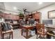 Spacious home office with custom built-in cabinetry, providing ample storage and workspace, and a ceiling fan at 4521 W Clarendon Ave, Phoenix, AZ 85031