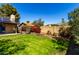 Enjoy this landscaped backyard with lush grass, a privacy fence, and colorful plants for a serene escape at 4839 E Marilyn Rd, Scottsdale, AZ 85254