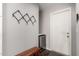 This modern entryway offers a sleek beverage cooler and coat rack wall décor at 4839 E Marilyn Rd, Scottsdale, AZ 85254