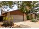 Single-story home featuring desert landscaping and a two-car garage at 4839 E Marilyn Rd, Scottsdale, AZ 85254