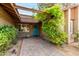 Charming home entrance with a blue door and lush green foliage at 4839 E Marilyn Rd, Scottsdale, AZ 85254